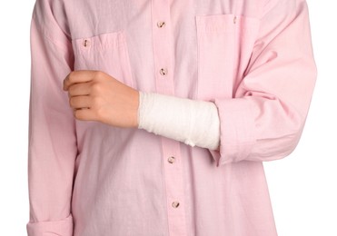 Photo of Woman with wrist wrapped in medical bandage on white background, closeup