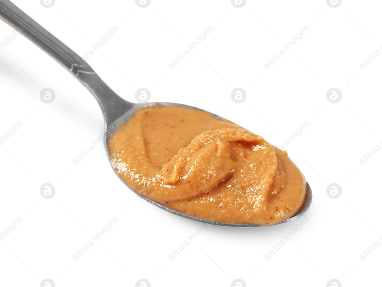 Photo of Delicious nut butter in spoon isolated on white