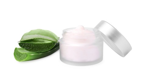 Jar of natural cream and cut aloe isolated on white