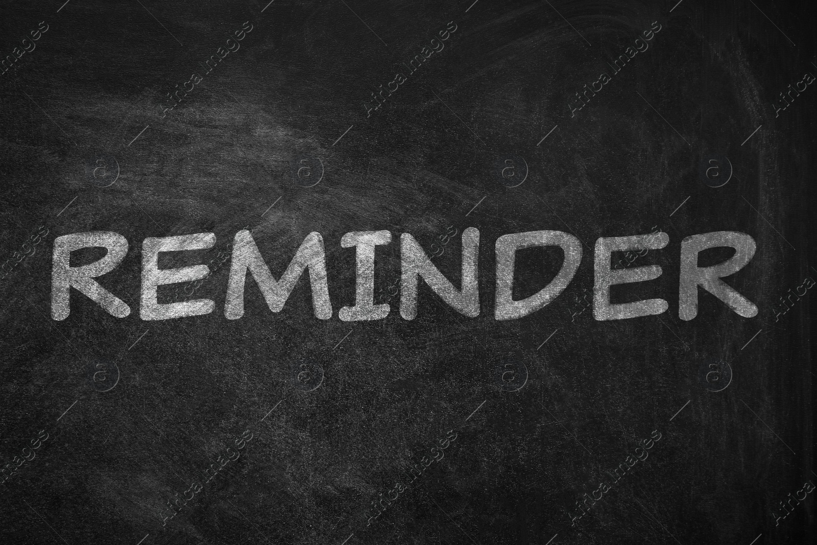 Image of Word REMINDER written on blackboard. Don't forget 