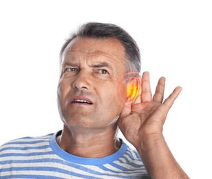 Mature man with hearing problem on white background 