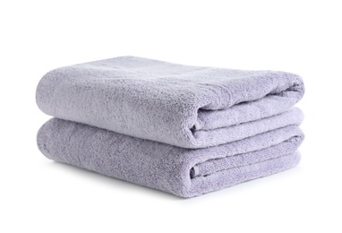 Photo of Fresh soft folded towels isolated on white