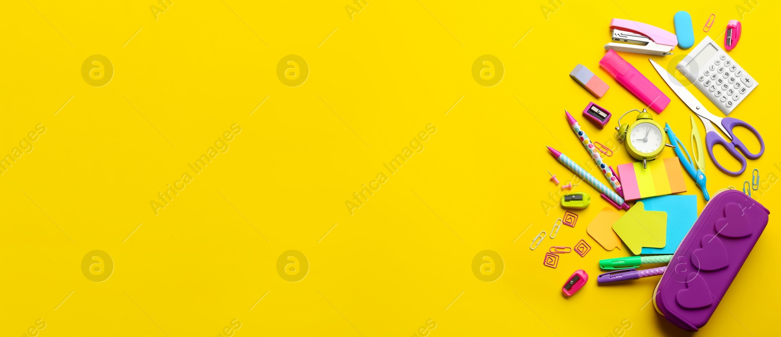 Photo of School stationery on yellow background, flat lay with space for text. Back to school