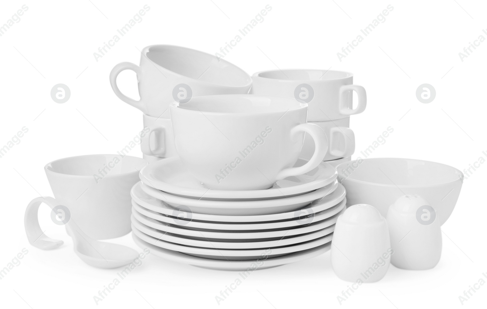 Photo of Set of clean dishware isolated on white