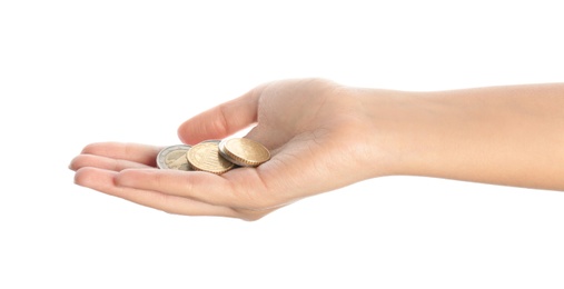 Young woman holding coins isolated on white, closeup