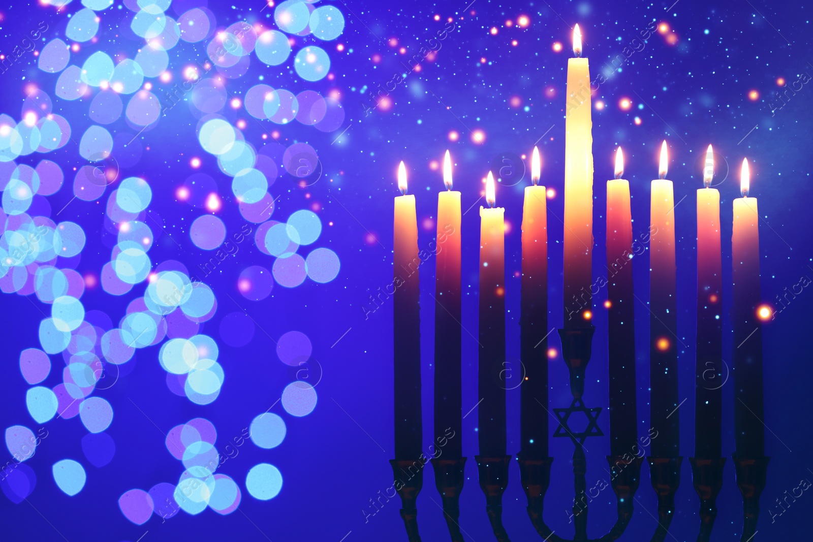 Image of Hanukkah celebration. Menorah with burning candles on blue background with blurred lights, closeup. Space for text