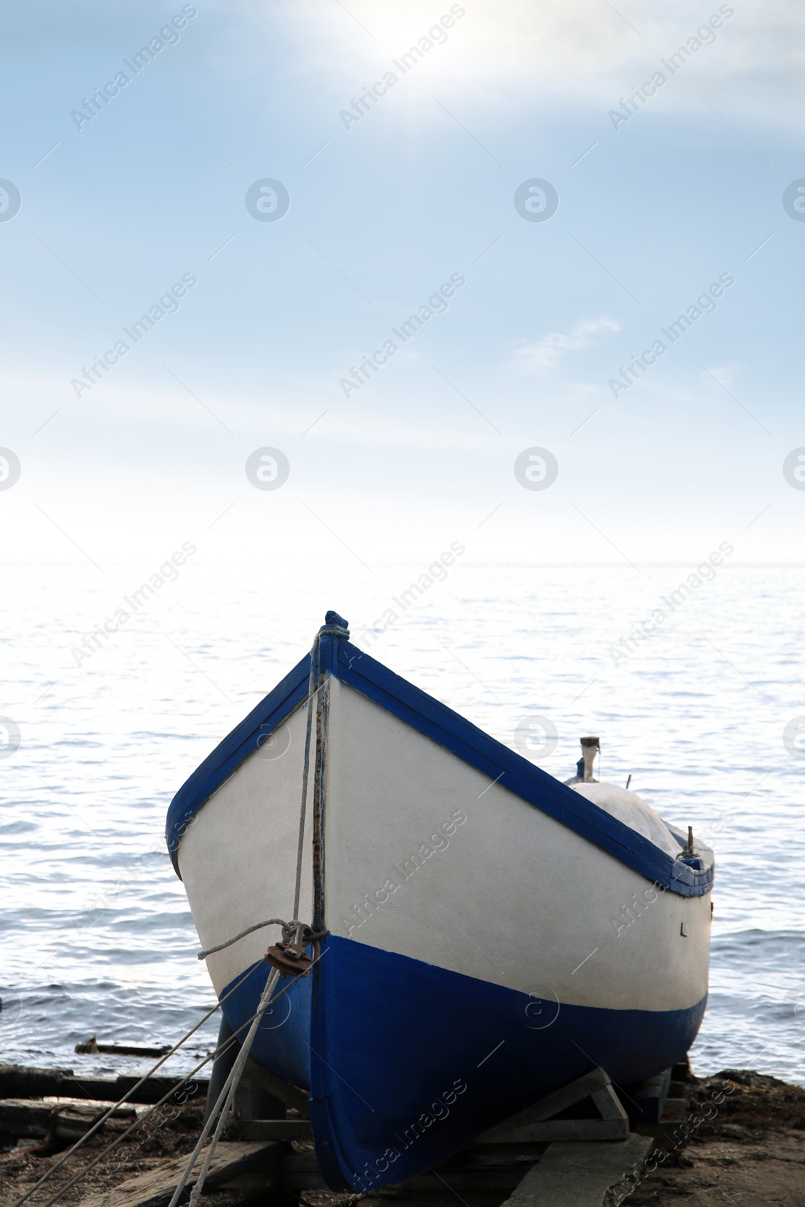 Photo of Moored boat on beach near sea outdoors