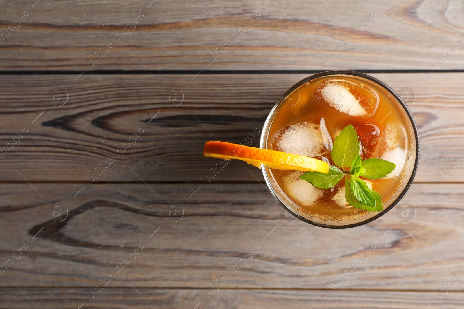 Photo of Tasty refreshing drink with coffee and orange juice on wooden table, top view. Space for text