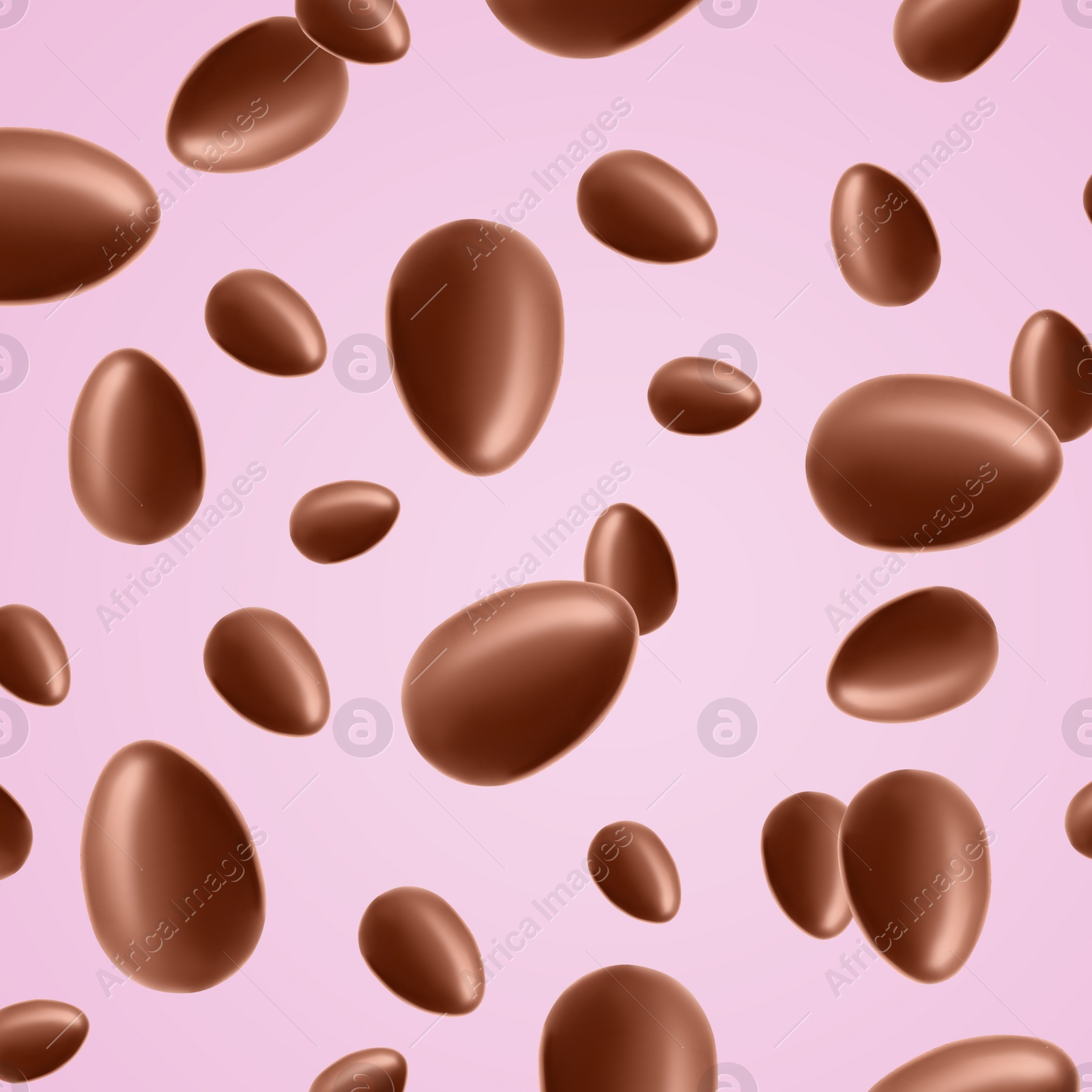 Image of Many chocolate eggs falling on pale pink background