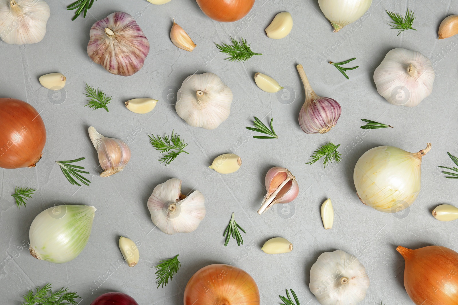 Photo of Flat lay composition with garlic and onion on table