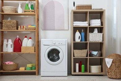 Laundry room interior with washing machine and furniture