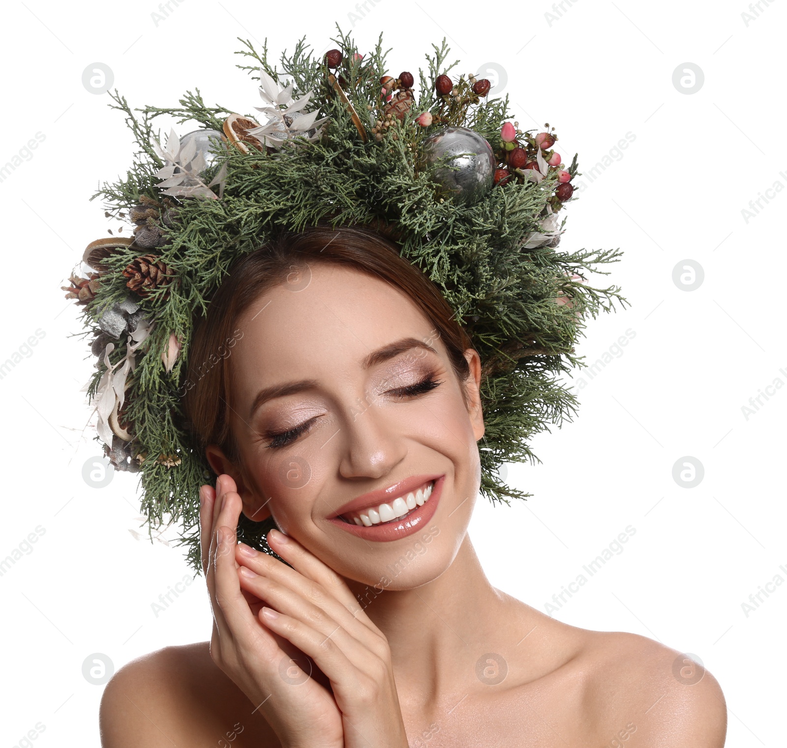 Photo of Beautiful young woman wearing Christmas wreath on white background