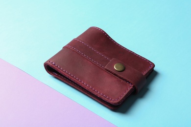 Photo of Leather wallet on color background. Stylish accessory