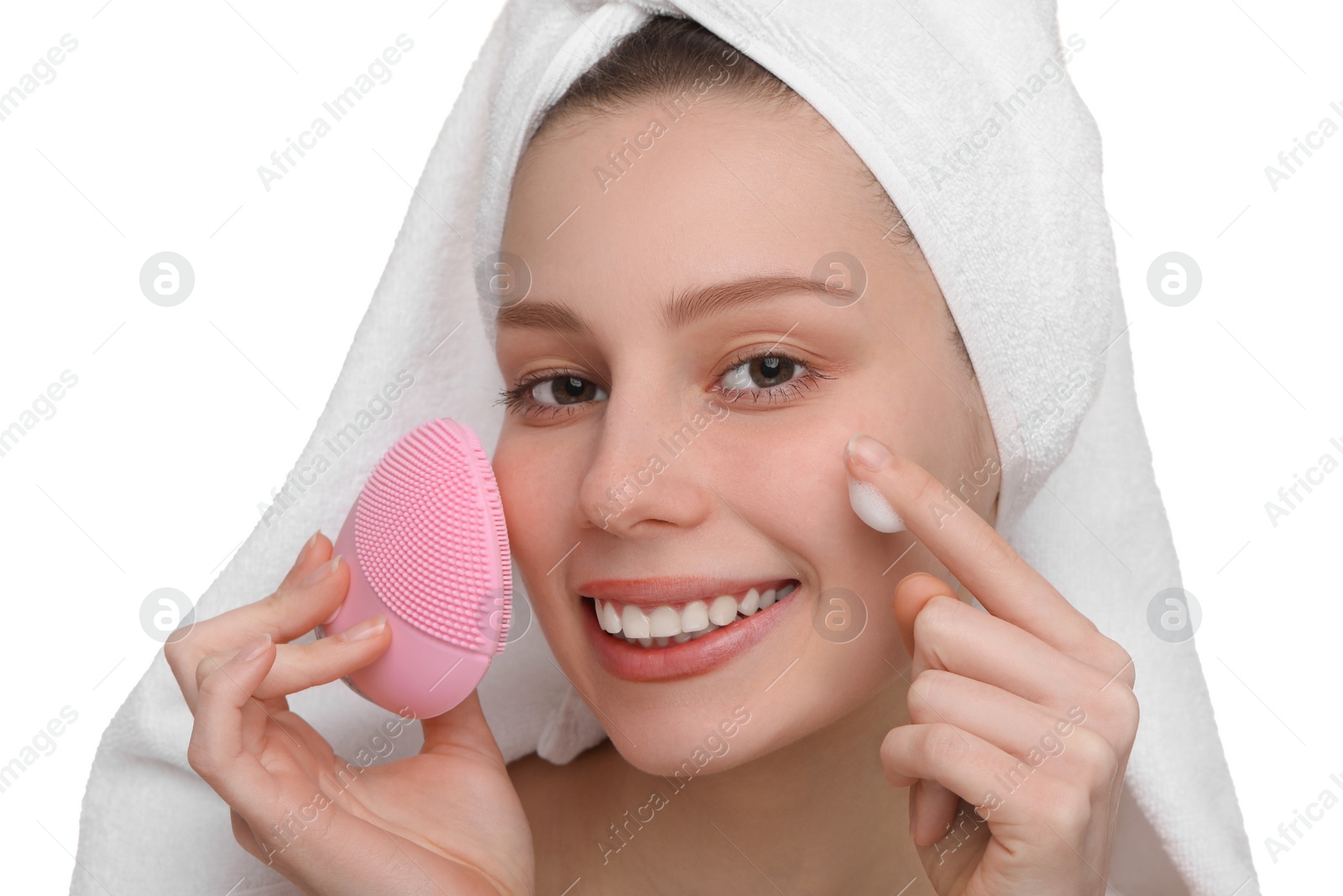 Photo of Washing face. Young woman with brush and cleansing foam on white background, closeup
