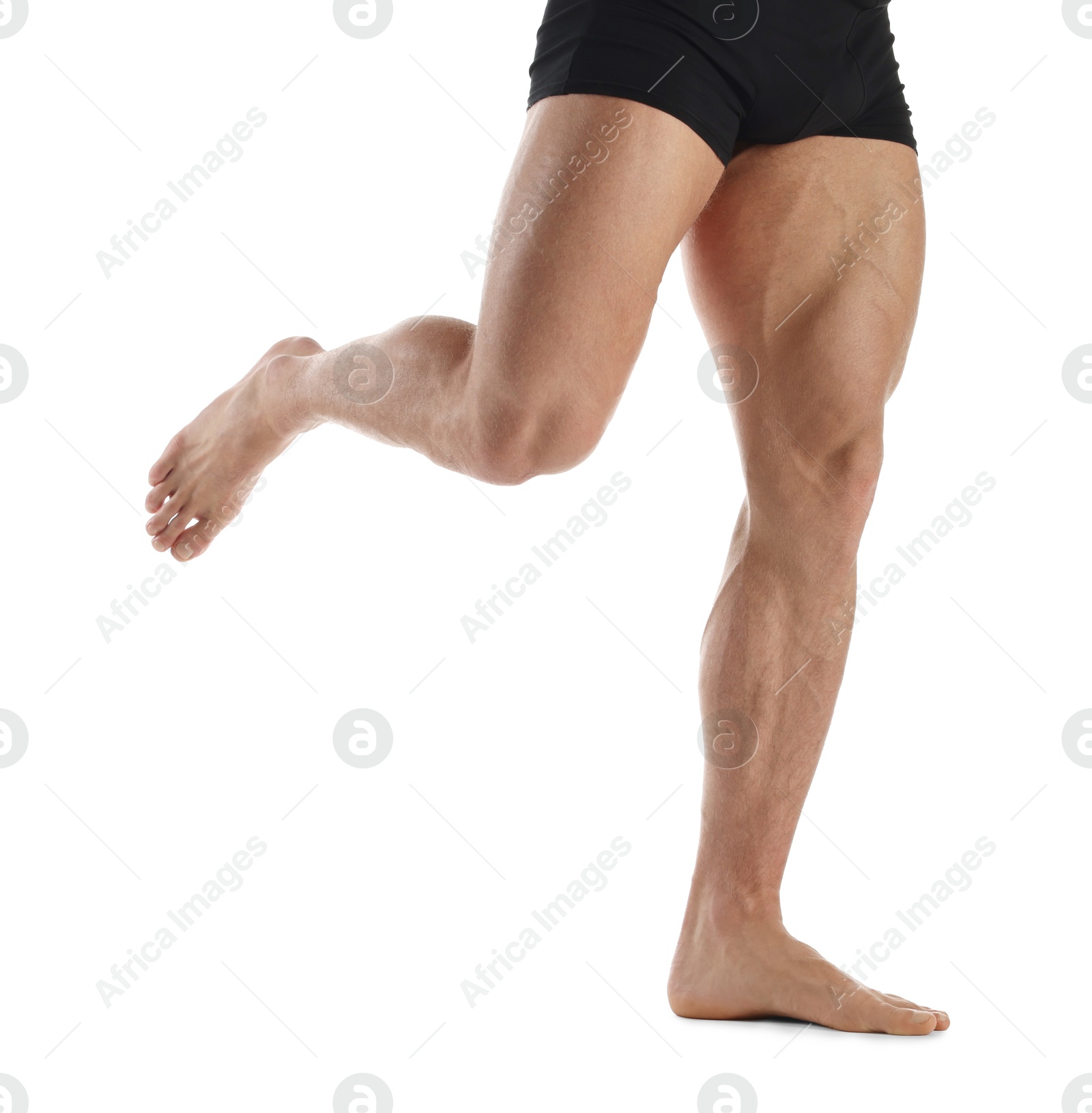 Photo of Man with muscular legs on white background, closeup