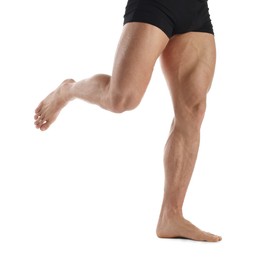 Photo of Man with muscular legs on white background, closeup