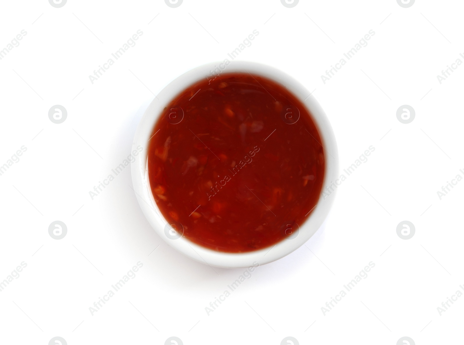 Photo of Delicious tomato sauce in bowl on white background, top view