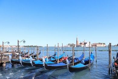 VENICE, ITALY - JUNE 13, 2019: Different gondolas at pier