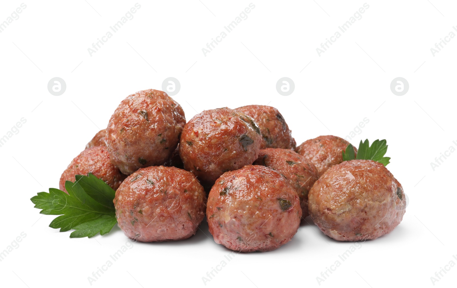 Photo of Many tasty cooked meatballs with parsley on white background