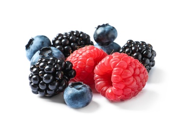 Raspberries, blackberries and blueberries on white background