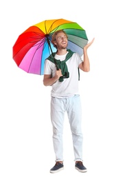 Man with rainbow umbrella on white background