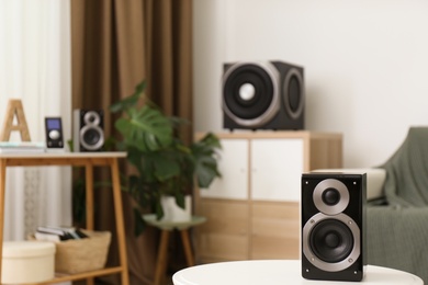 Photo of Modern powerful audio speaker system in bright room