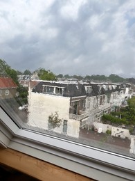 Window glass with water drops, view from inside. Rainy weather