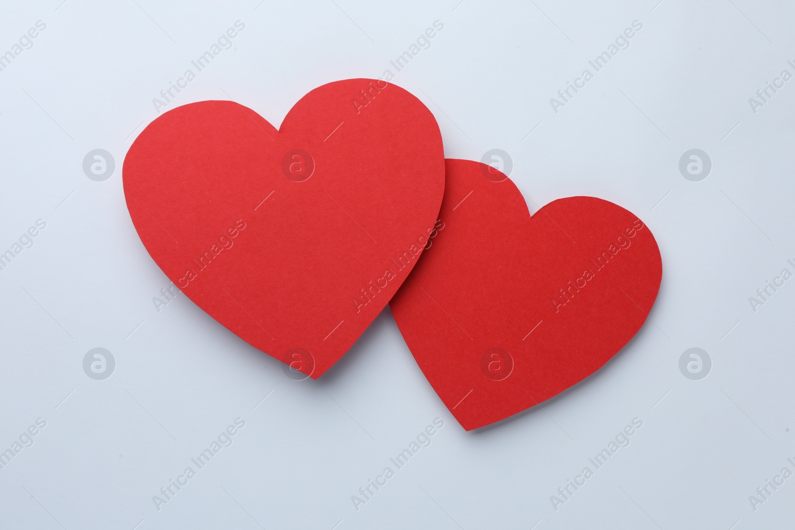 Photo of Paper hearts on white background, top view