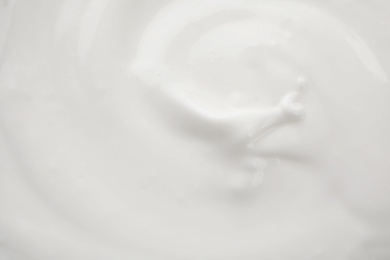 Delicious creamy yogurt as background, closeup view