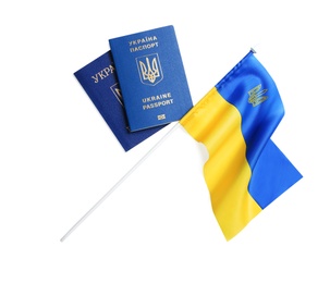 Ukrainian passports and national flag on white background, top view. International relationships