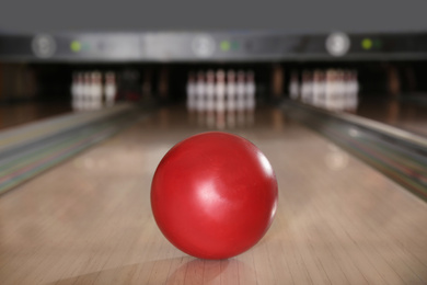 Photo of Red ball on bowling lane in club