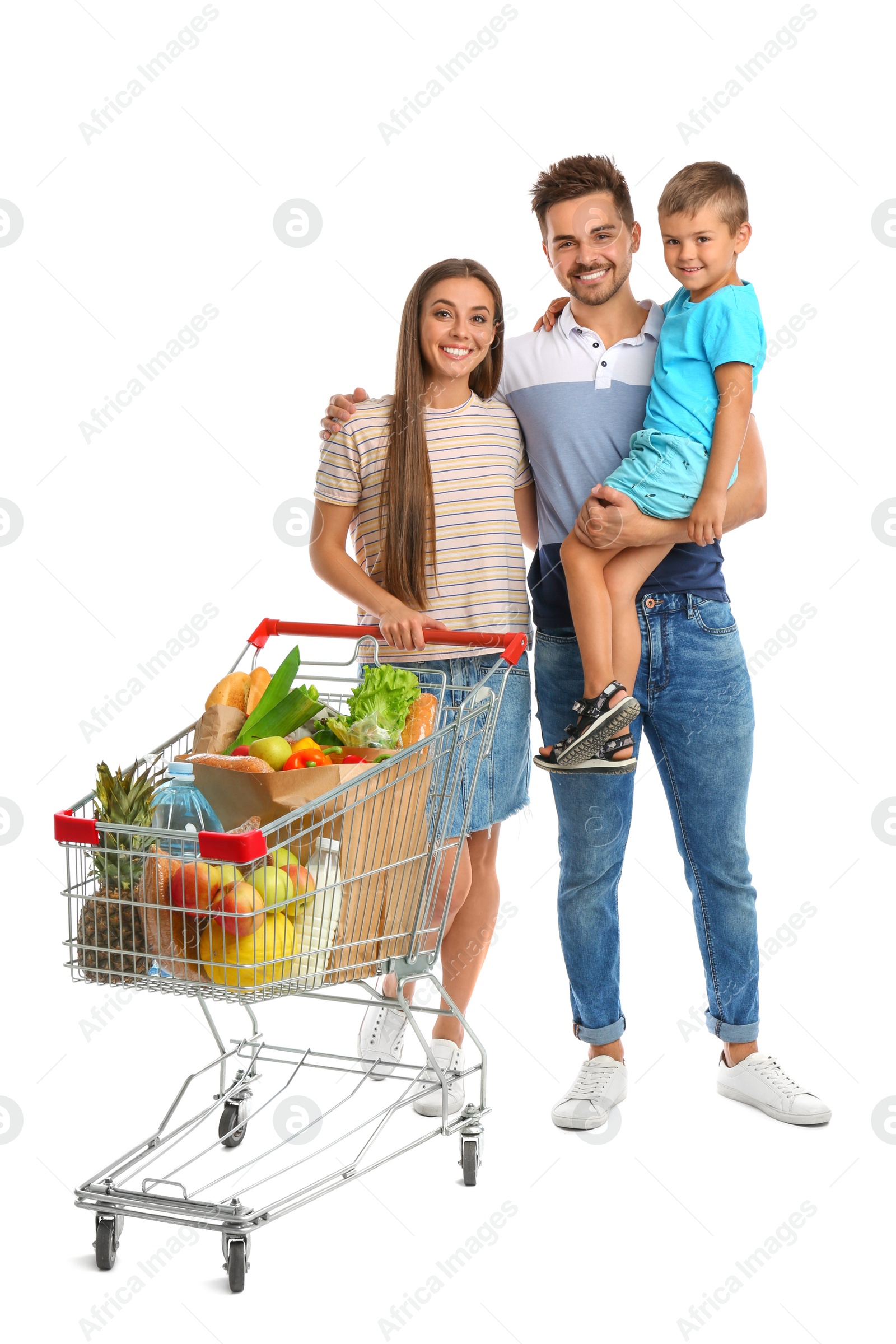 Photo of Happy family with full shopping cart on white background