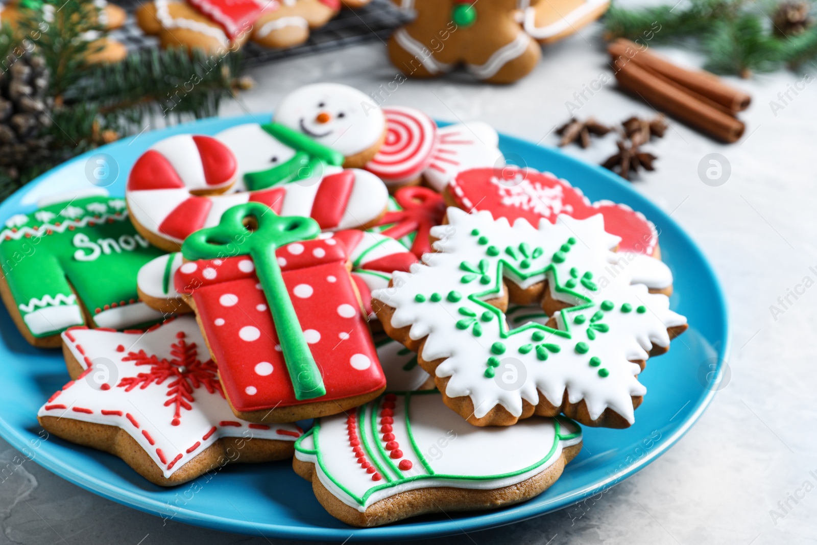 Photo of Delicious Christmas cookies on light marble table, closeup