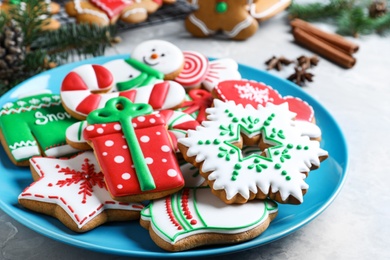 Photo of Delicious Christmas cookies on light marble table, closeup