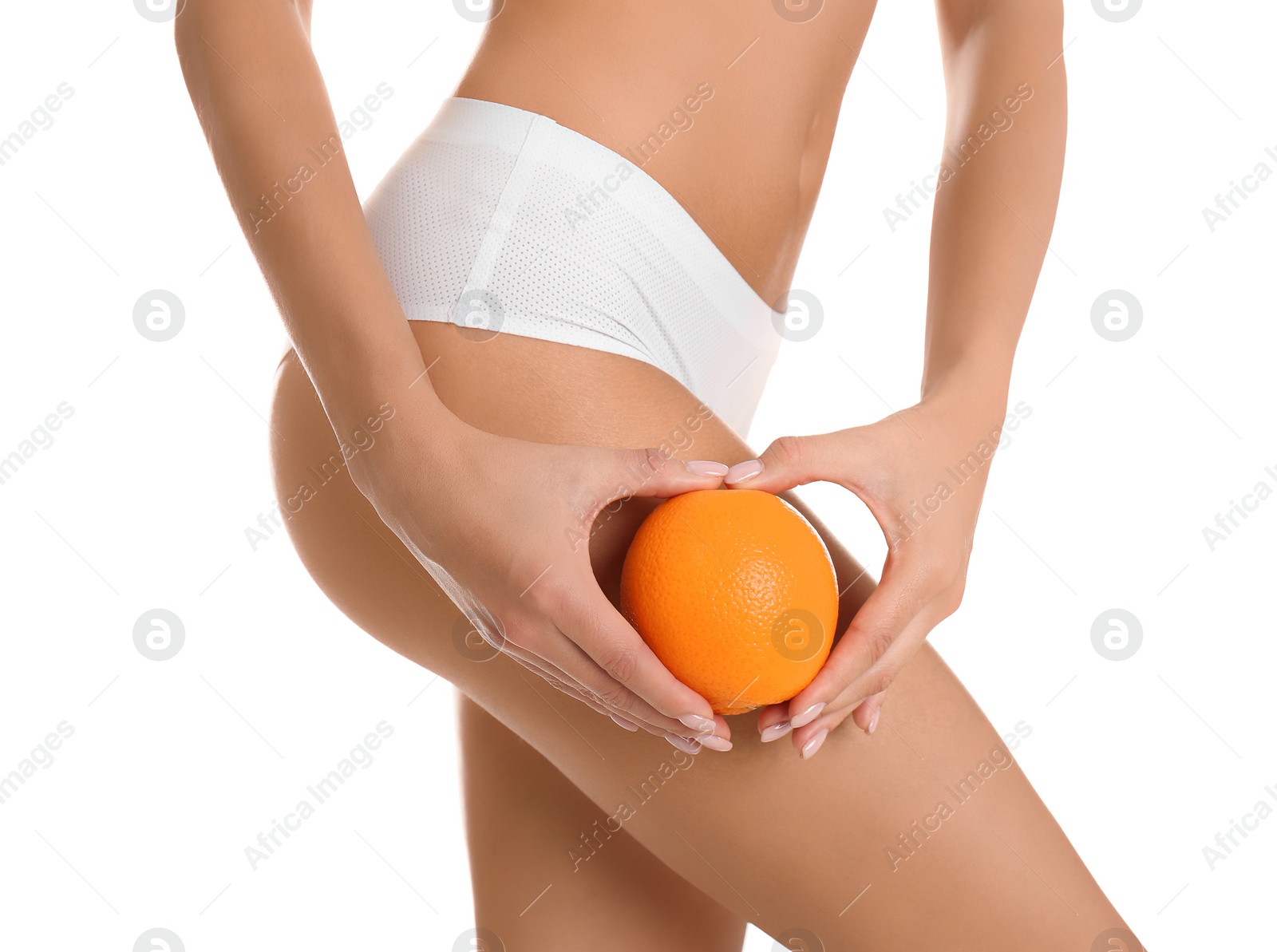 Photo of Closeup view of slim woman in underwear with orange on white background. Cellulite problem concept