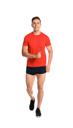 Photo of Sporty young man running on white background