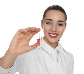 Photo of Professional pharmacist with ampule of medicine on white background