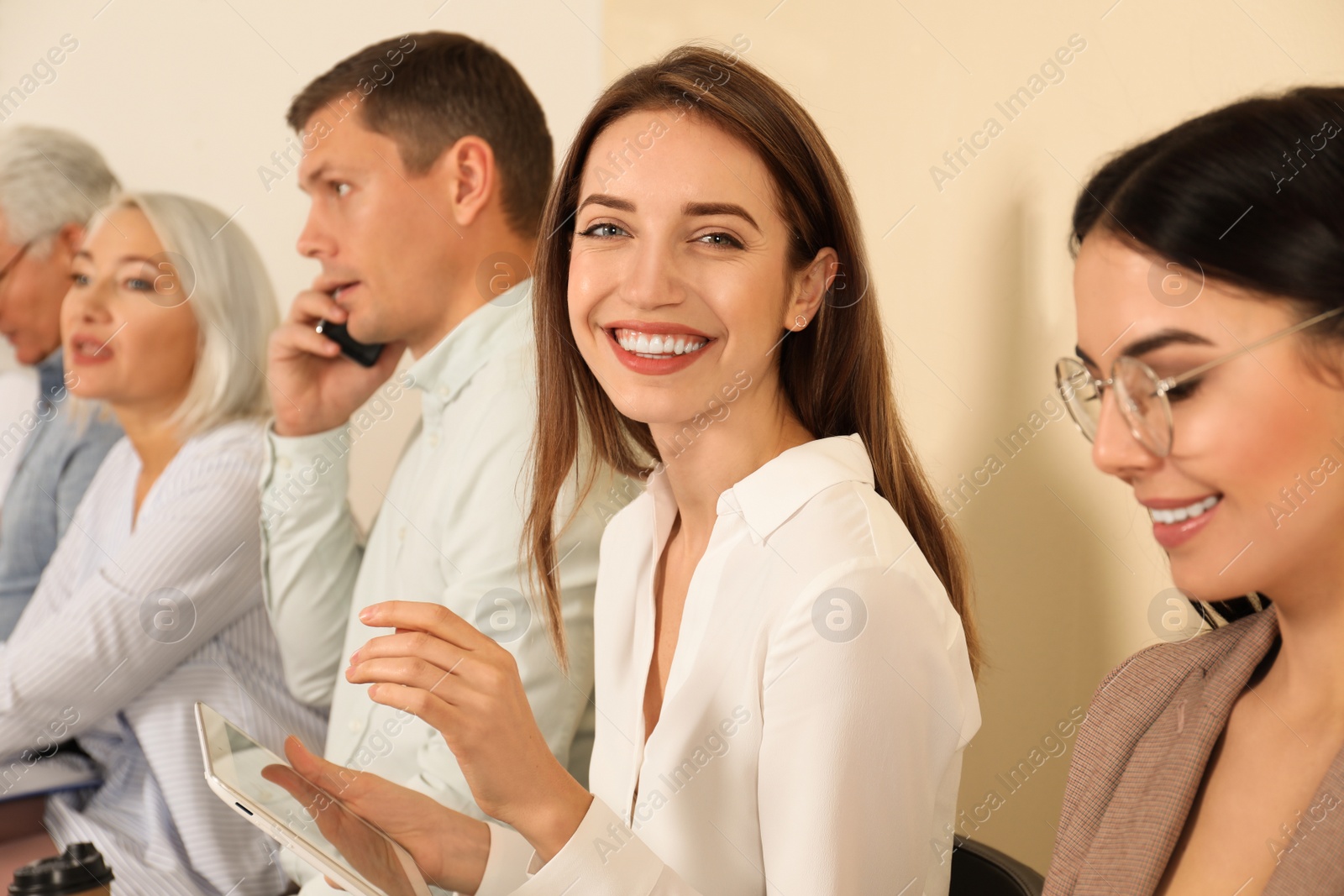 Photo of Woman with tablet waiting for job interview in office