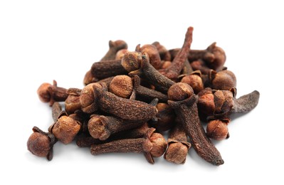 Photo of Pile of aromatic dry cloves on white background