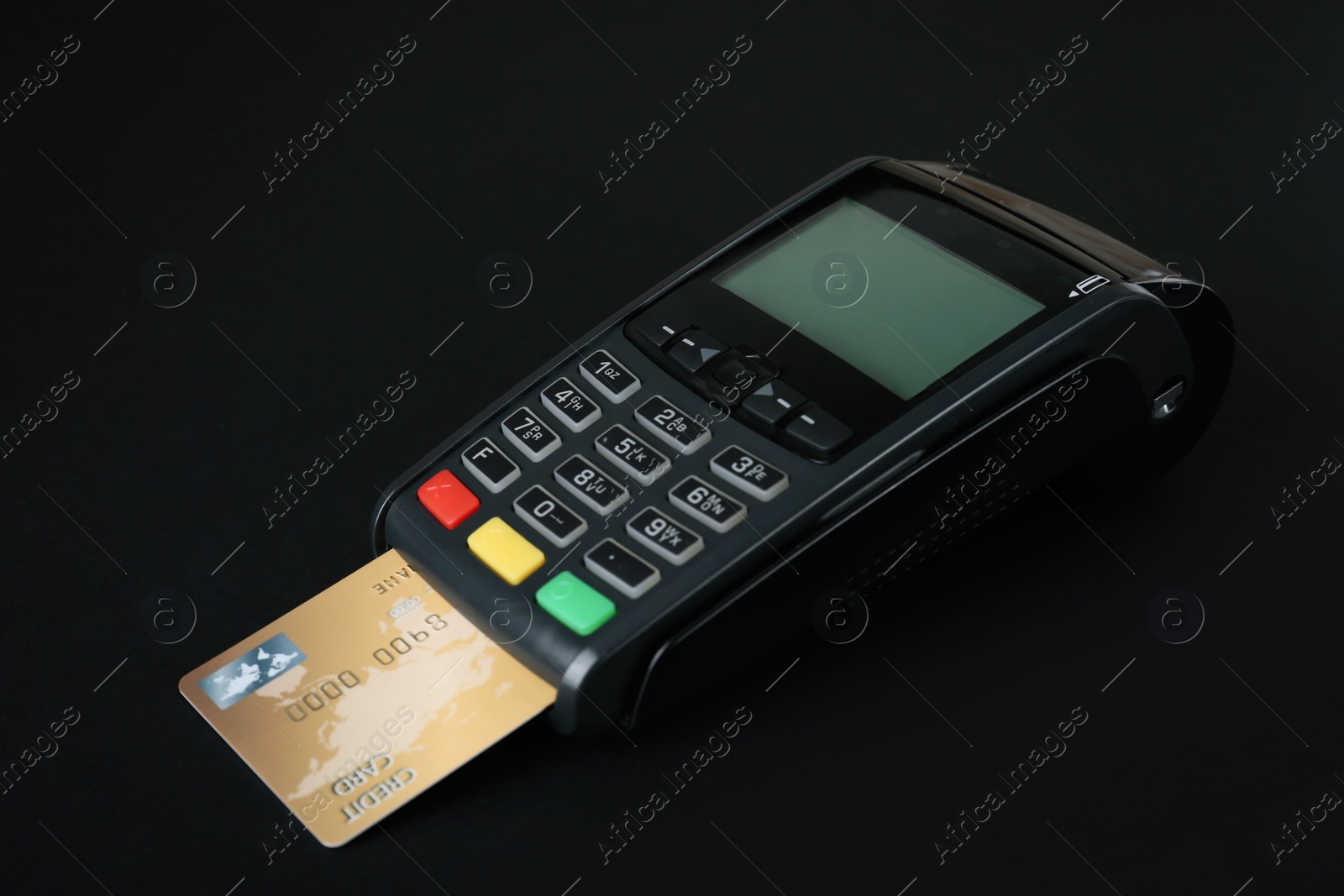 Photo of New modern payment terminal with credit card on black background