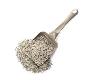 Photo of Grey plastic scoop with cat litter isolated on white, top view