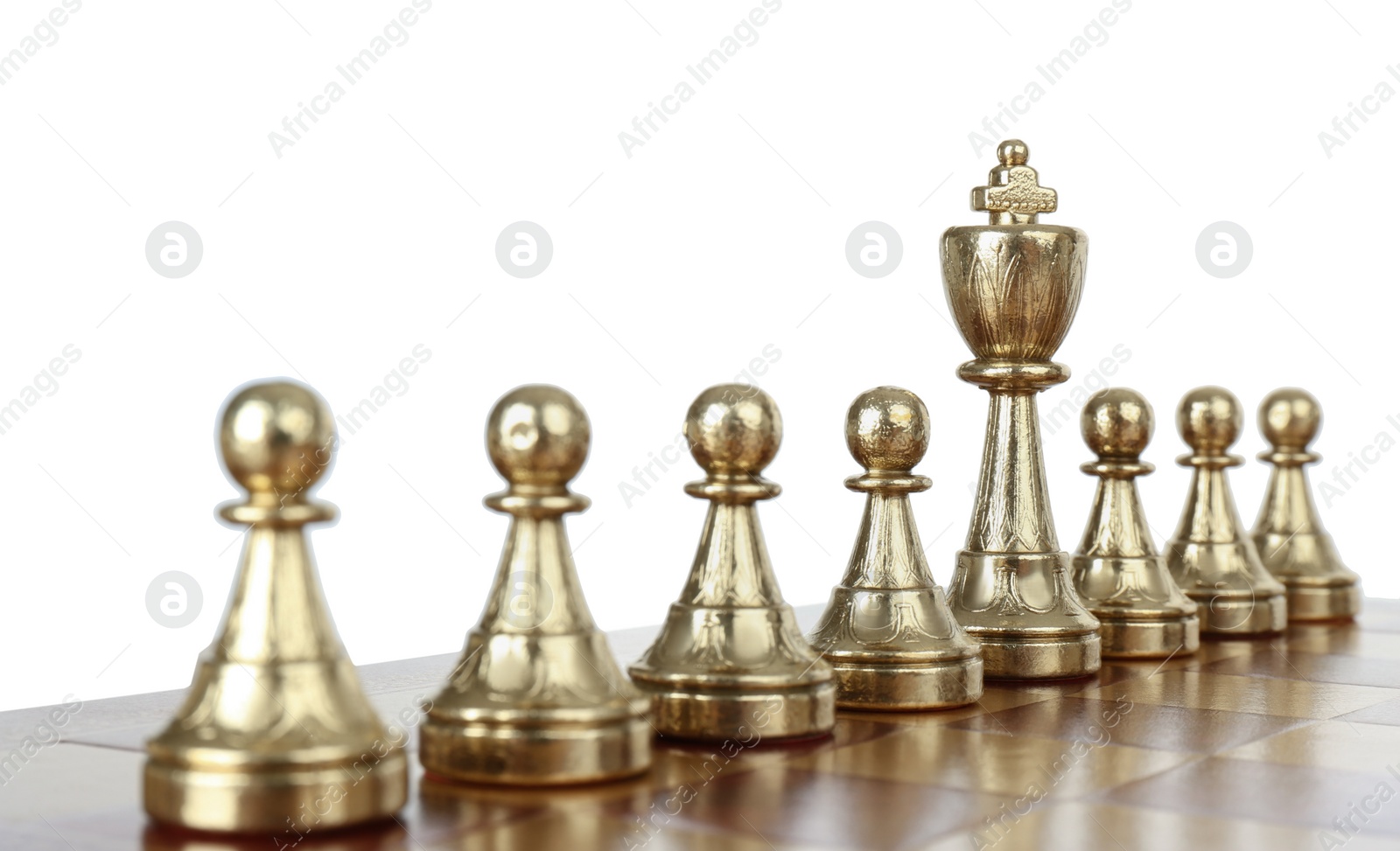 Photo of King among pawns on wooden chess board against white background