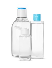 Photo of Bottles of micellar cleansing water on white background