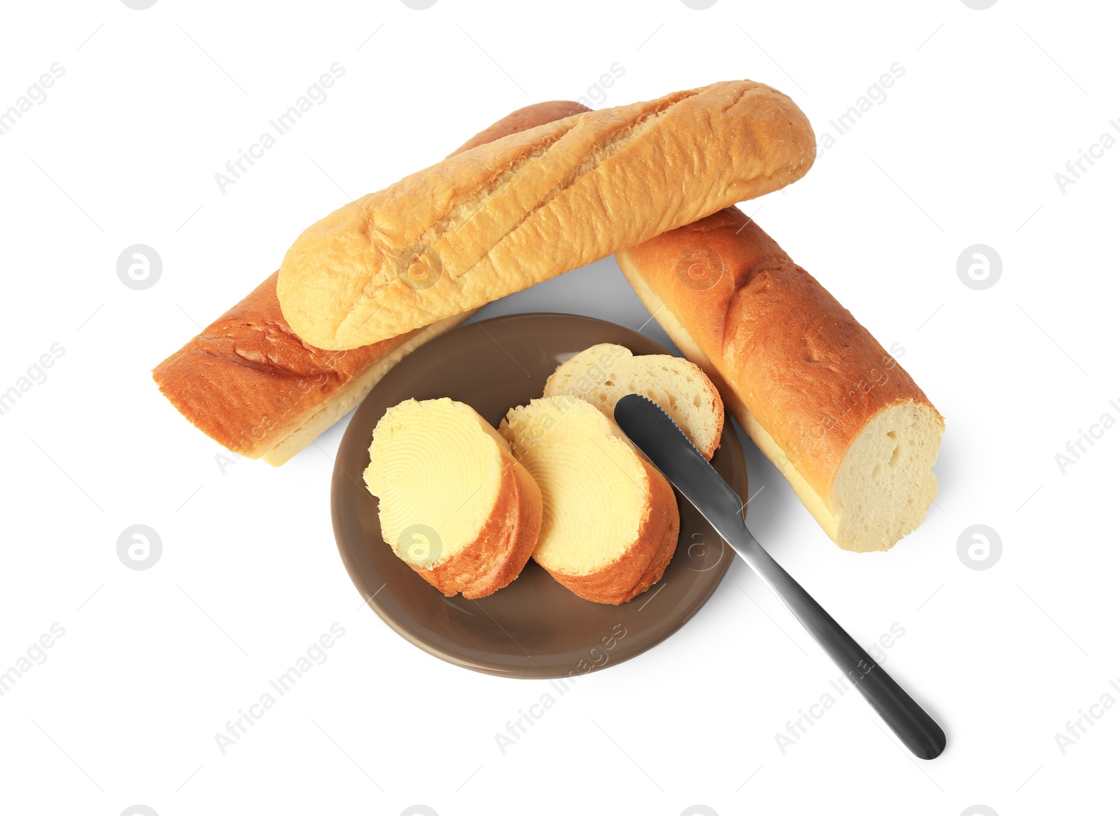 Photo of Cut baguettes with fresh butter on white background, above view