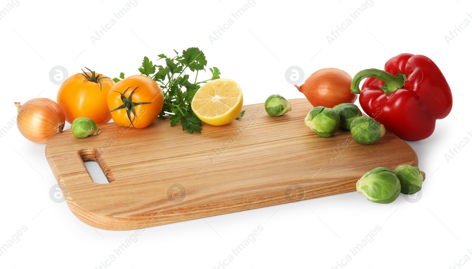 Photo of Wooden cutting board with different fresh vegetables isolated on white