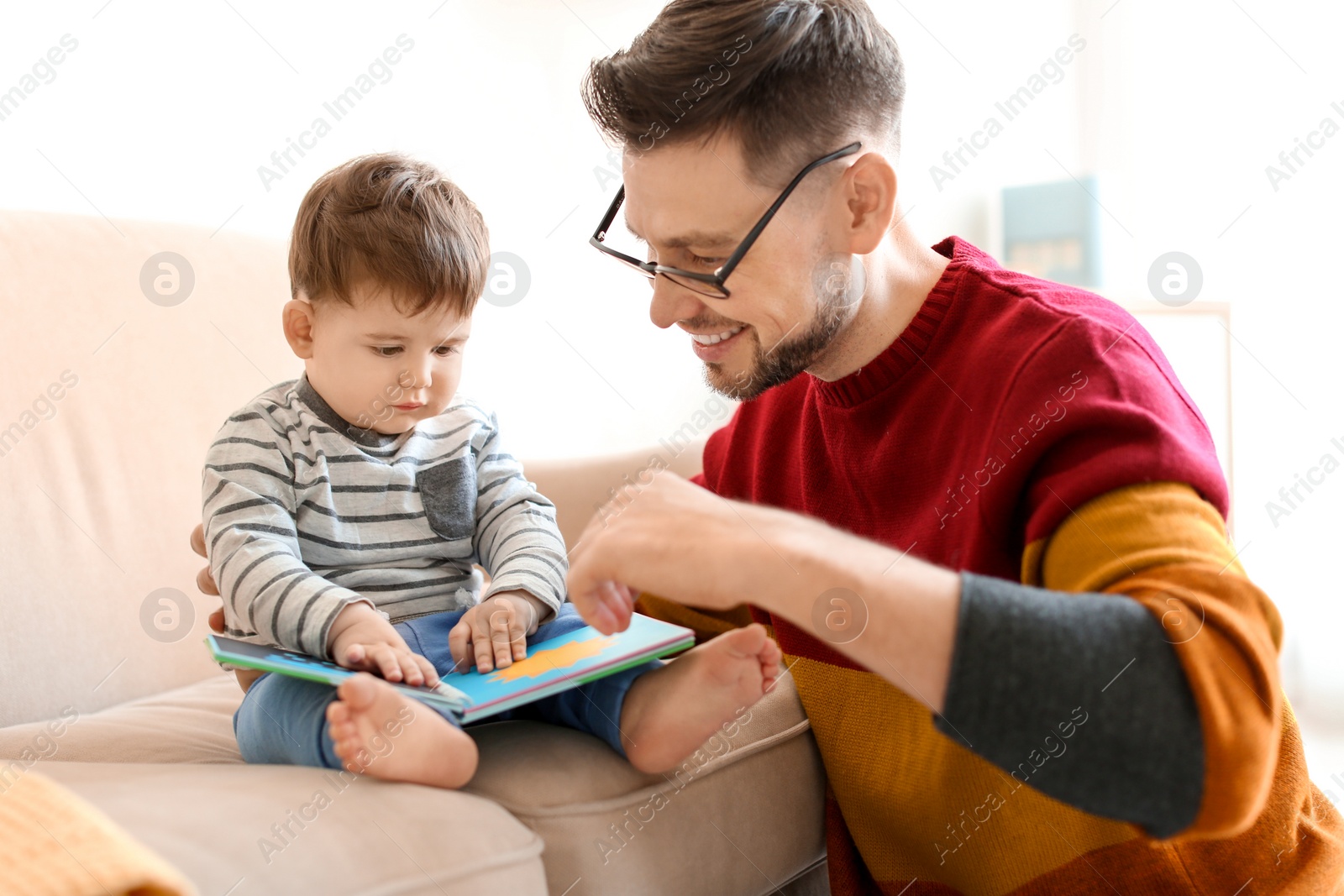 Photo of Dad spending time with his son at home