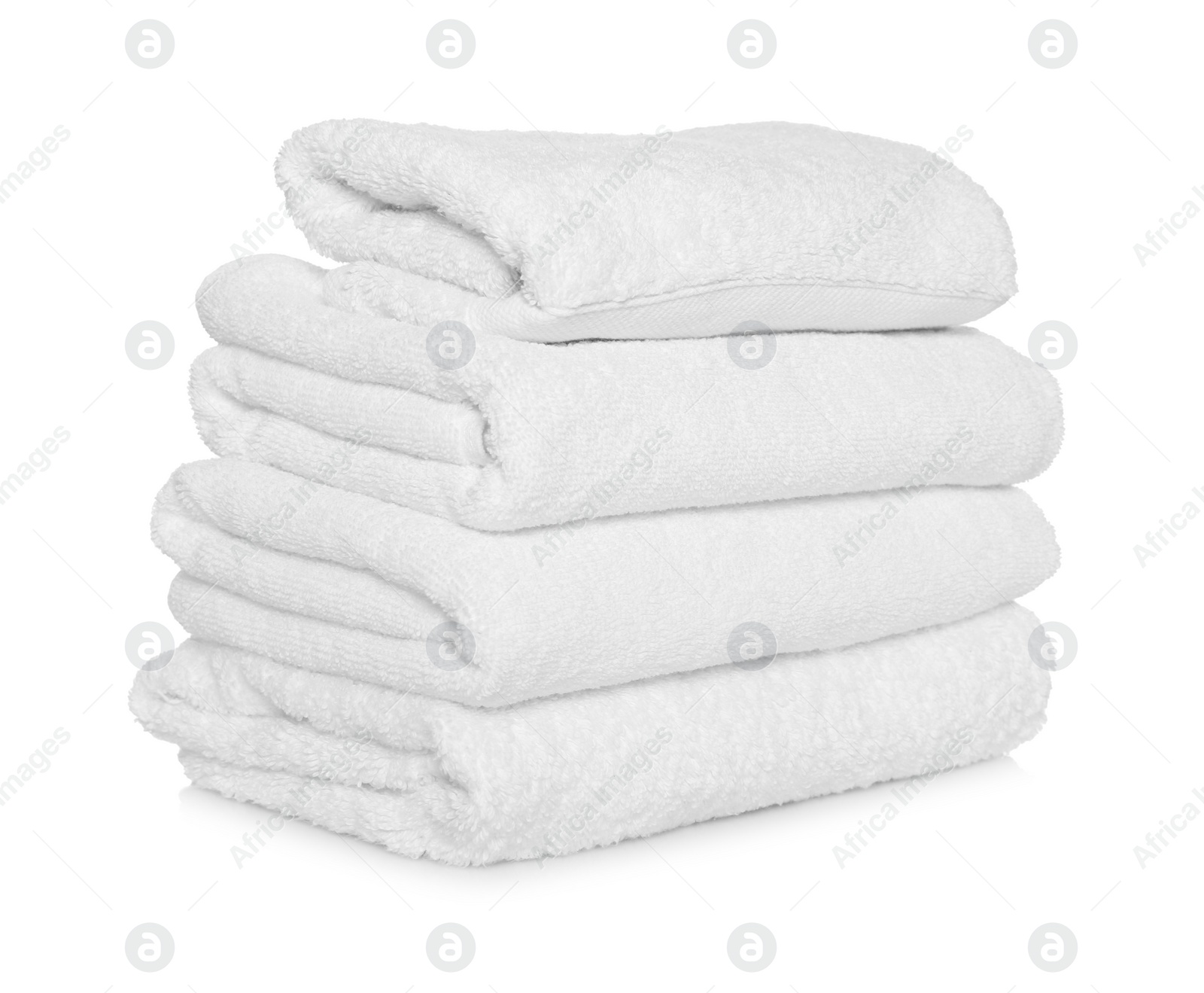 Photo of Folded soft terry towels on white background