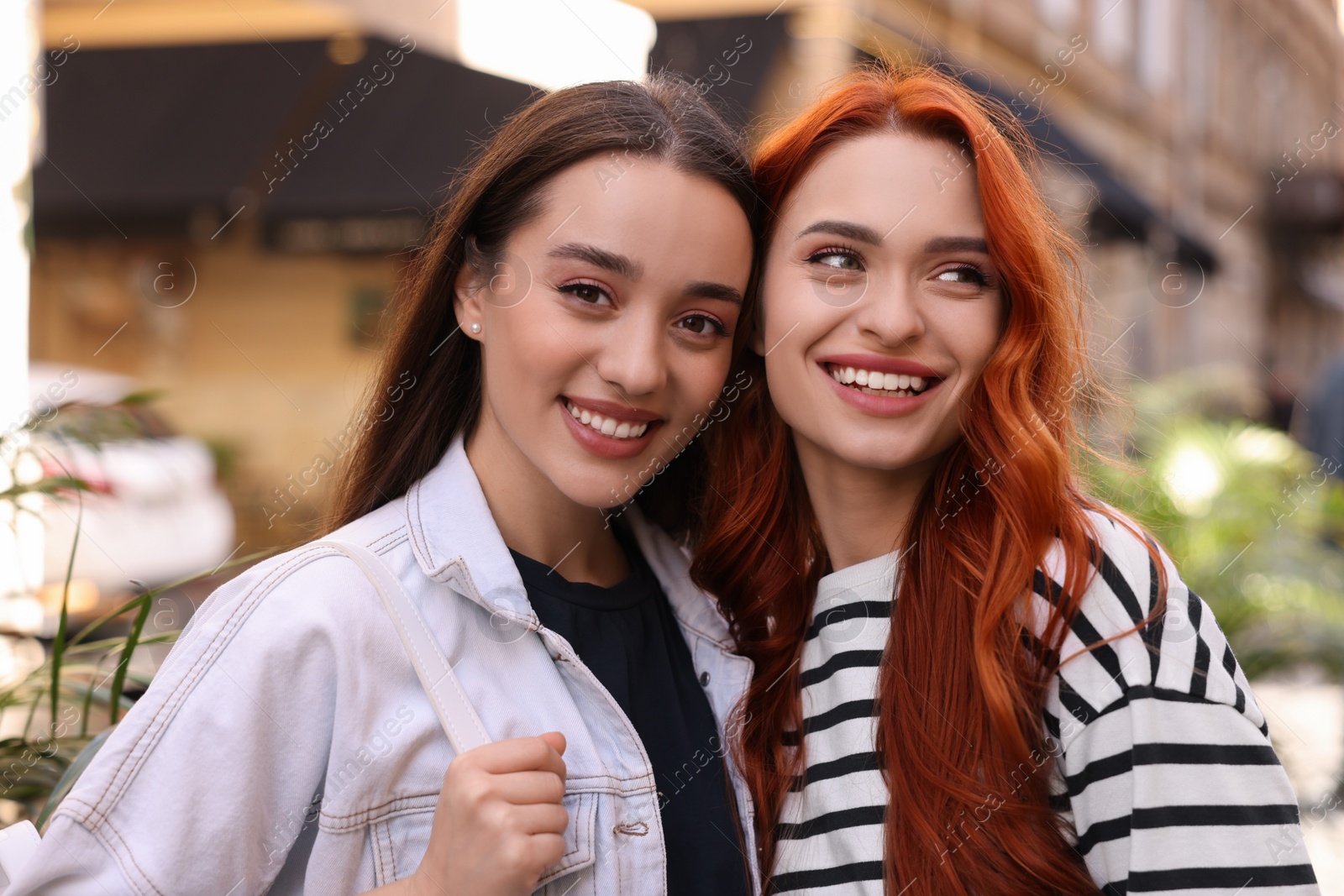 Photo of Portrait of happy friends spending time together outdoors