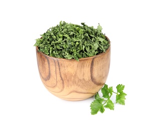 Bowl with dried parsley and fresh twig on white background