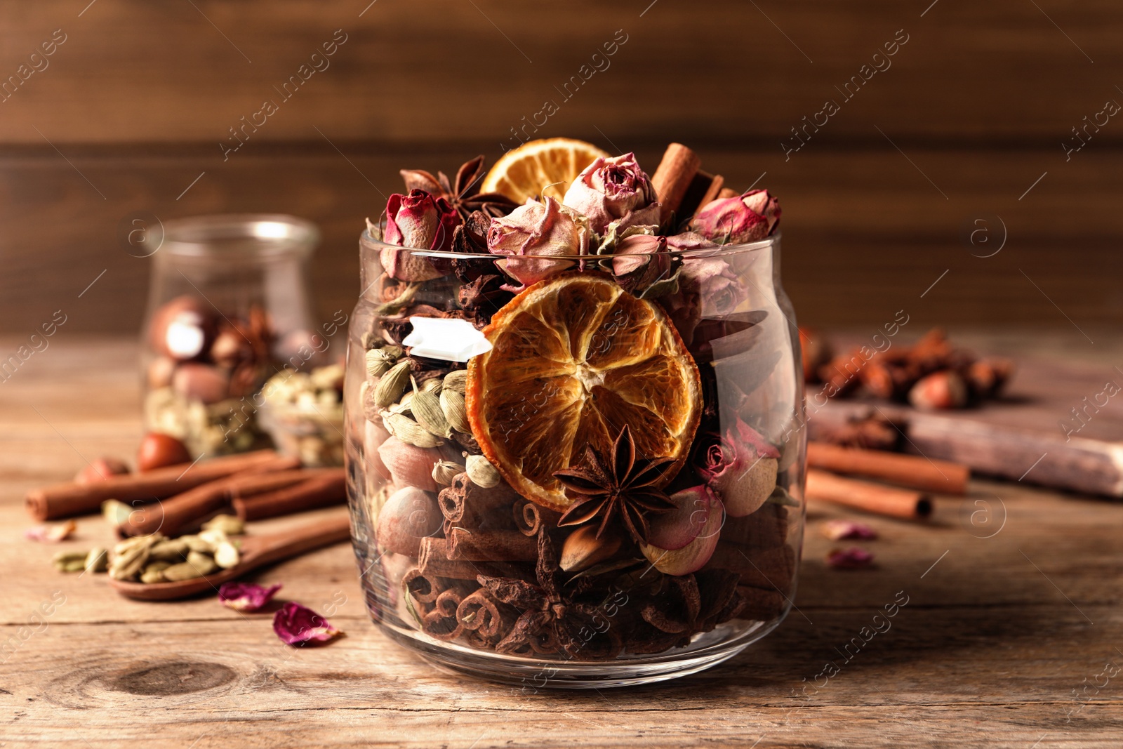 Photo of Aroma potpourri with different spices on wooden table